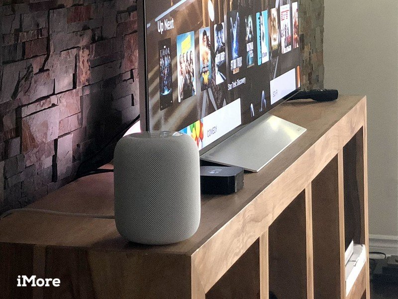 White HomePod sitting on a television stand