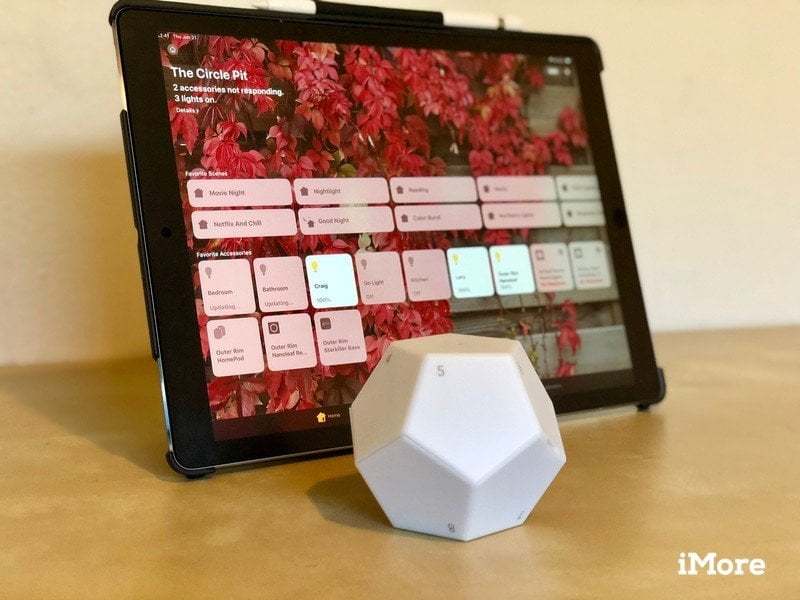 Nanoleaf remote control on a flat surface in front of an iPad