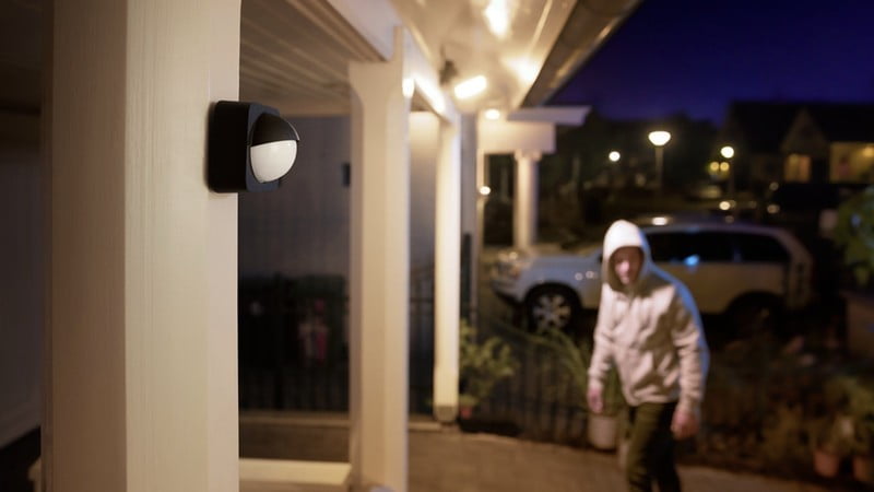 The Philips Hue Outdoor Motion Sensor is installed with a view to the entrance of a house